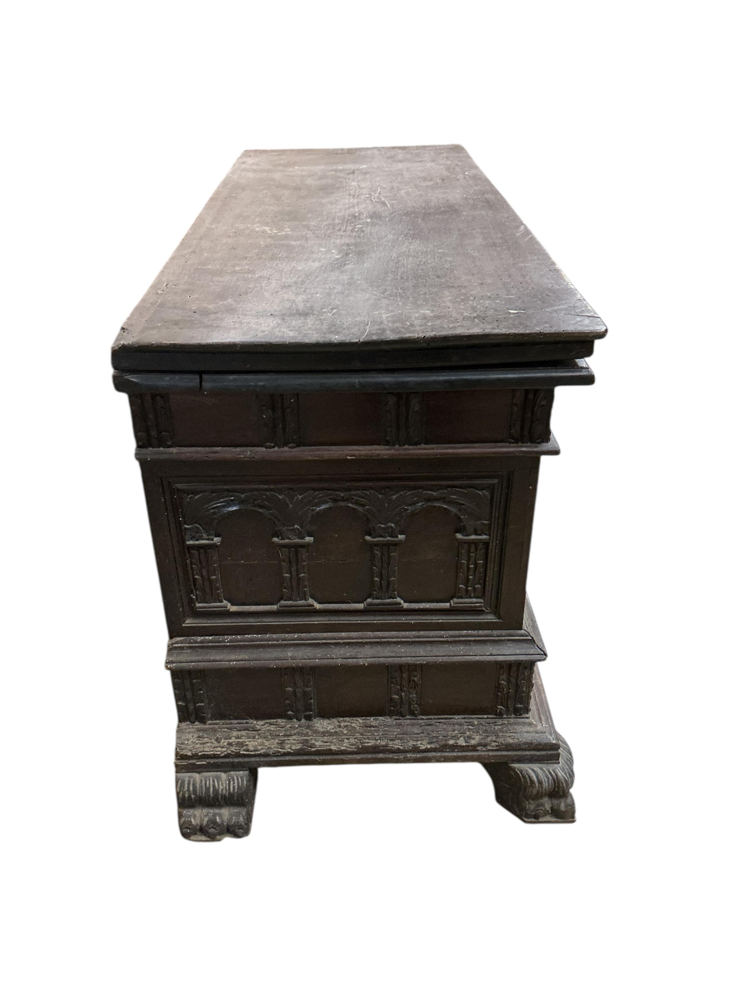 An Italian carved walnut cassone, width 138cm, depth 54cm, height 76cm